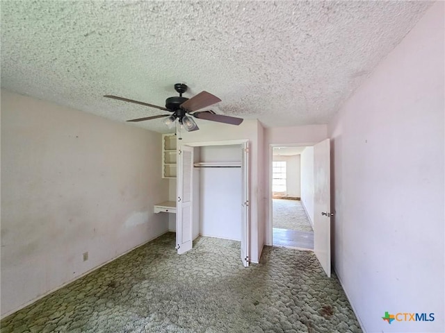 403 Schell Rd, Victoria, TX 77904 - unfurnished bedroom with carpet floors, a textured ceiling, a closet, and a ceiling fan