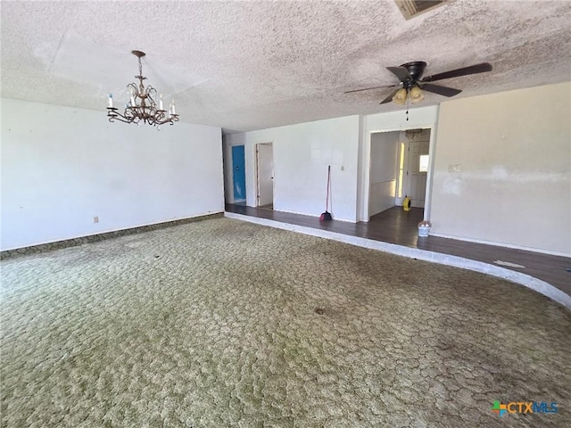 403 Schell Rd, Victoria, TX 77904 - spare room featuring a textured ceiling, carpet, a chandelier, and a ceiling fan
