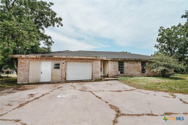 403 Schell Rd, Victoria, TX 77904 - view of front of property featuring brick siding, concrete driveway, and an attached garage