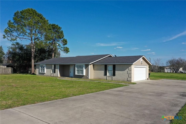 ranch-style house featuring concrete driveway, brick siding, an attached garage, and a front yard