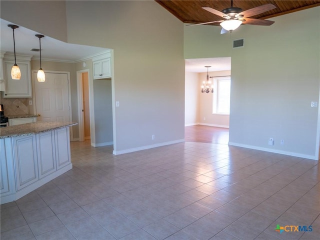 interior space with wooden ceiling, baseboards, visible vents, and ceiling fan with notable chandelier