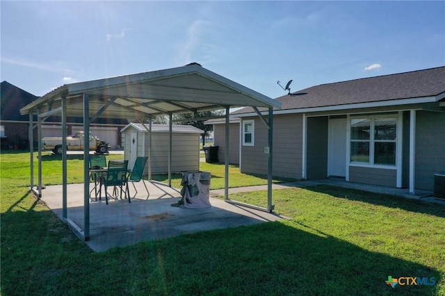 exterior space with a patio area, a shed, a lawn, and an outbuilding