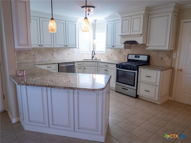 kitchen with appliances with stainless steel finishes, a peninsula, light stone countertops, premium range hood, and a sink