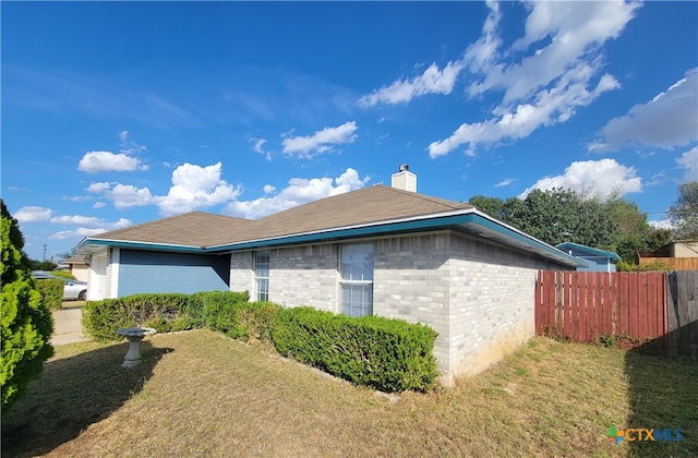 view of home's exterior featuring a lawn