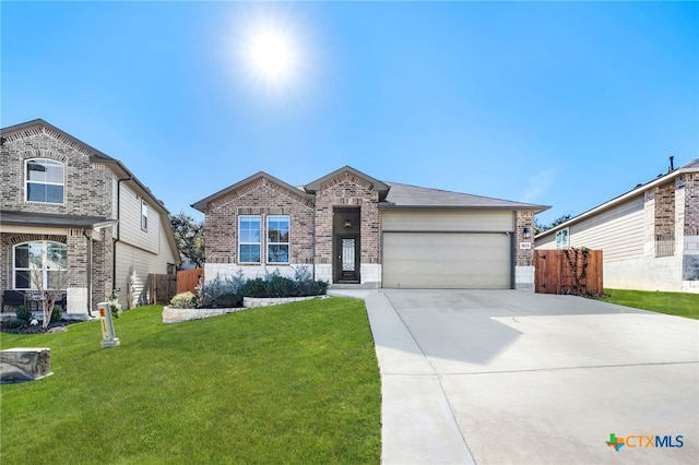 view of front of property featuring a garage and a front lawn