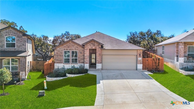 view of front of property featuring a garage and a front yard