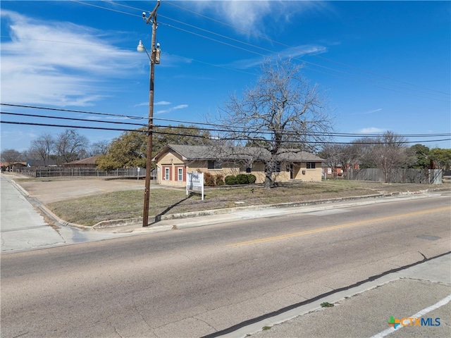 view of front of home with fence