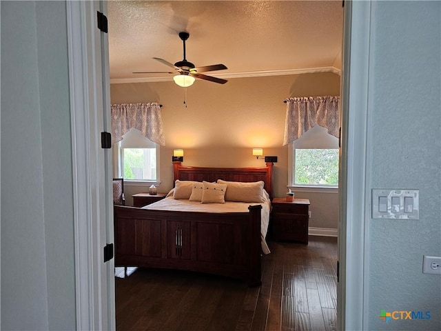 1169 Creek Cyn, New Braunfels, TX 78132 - bedroom with crown molding, dark wood-style floors, a textured ceiling, a textured wall, and a ceiling fan