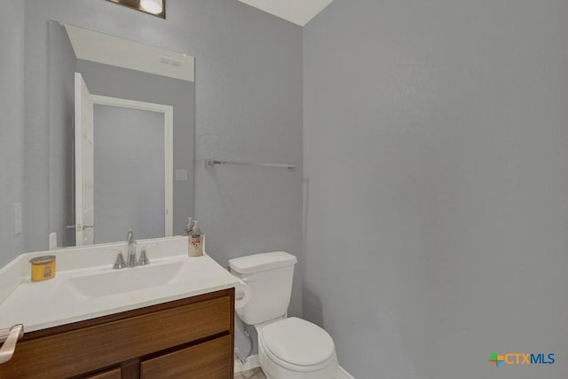 half bath with toilet and vanity