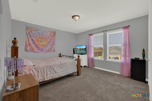 carpeted bedroom with baseboards