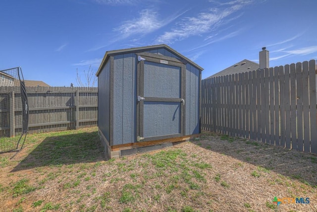 view of shed featuring a fenced backyard