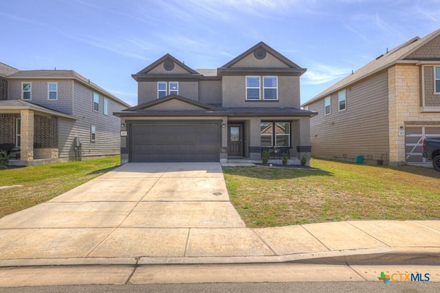 view of front of property with stucco siding, driveway, an attached garage, and a front lawn