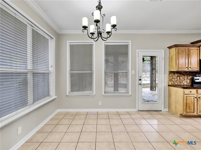 unfurnished dining area featuring crown molding, light tile patterned floors, and an inviting chandelier