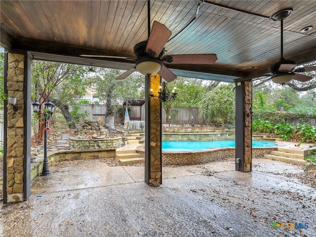 view of patio featuring ceiling fan and a fenced in pool