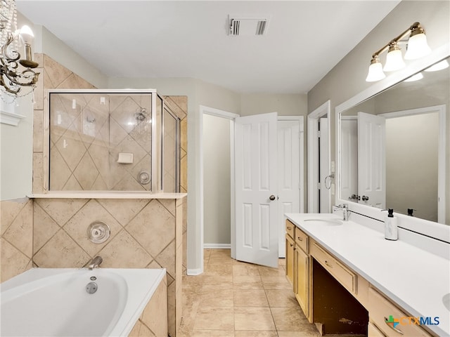 bathroom with tile patterned flooring, vanity, and independent shower and bath