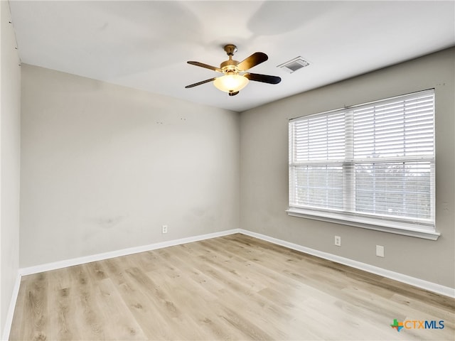 unfurnished room with ceiling fan and light hardwood / wood-style floors