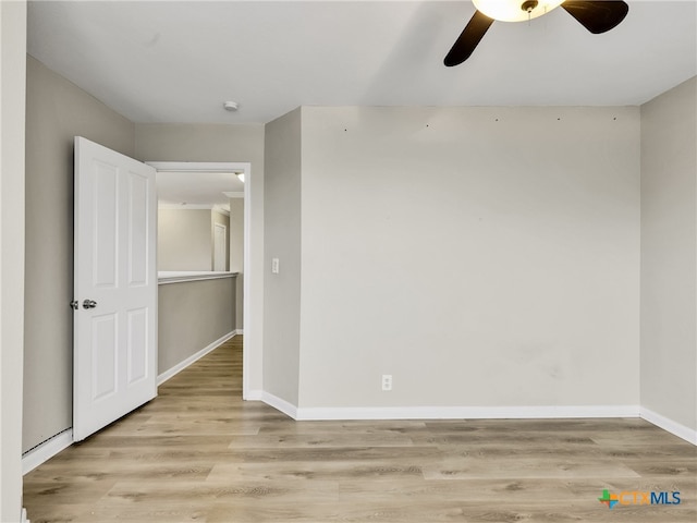 unfurnished room featuring light hardwood / wood-style floors and ceiling fan