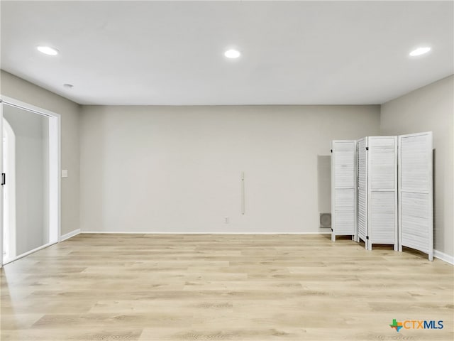 unfurnished room featuring light hardwood / wood-style floors