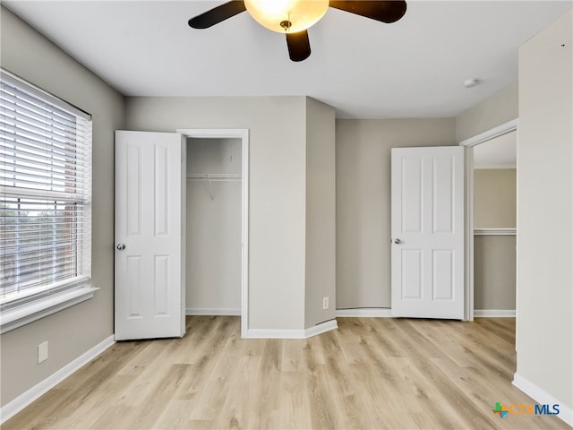 unfurnished bedroom featuring ceiling fan and light hardwood / wood-style floors