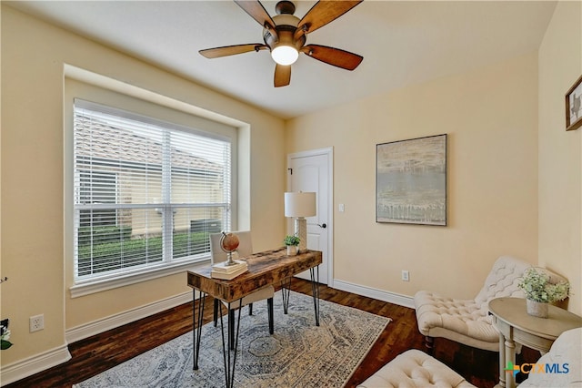 office space featuring ceiling fan and dark hardwood / wood-style flooring