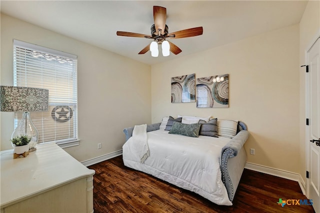 bedroom featuring ceiling fan and dark wood-type flooring