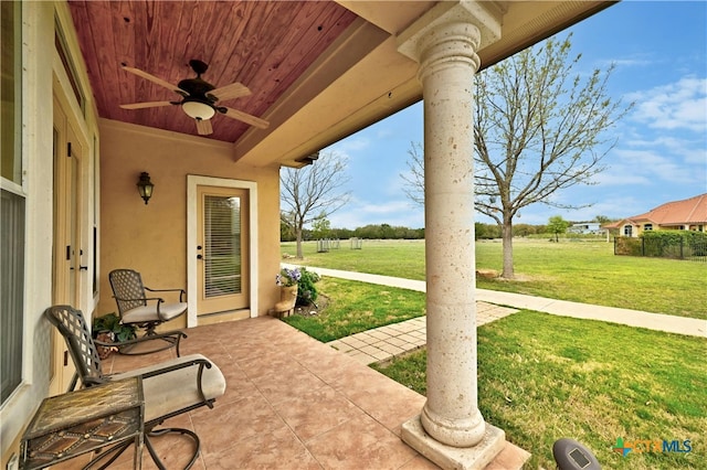 view of patio / terrace featuring ceiling fan