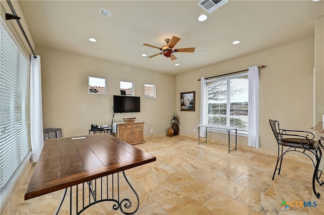 office space with ceiling fan