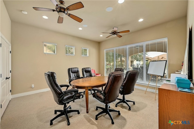 office space with ceiling fan and light carpet