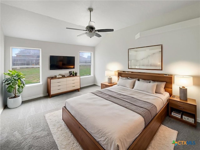 carpeted bedroom featuring ceiling fan and lofted ceiling