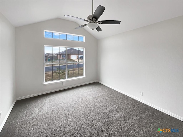 empty room featuring carpet floors, vaulted ceiling, and ceiling fan