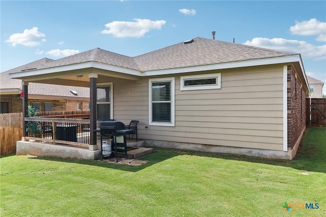 2024 Cowan Dr, New Braunfels, TX 78132 - back of property featuring roof with shingles and brick siding