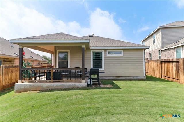 2024 Cowan Dr, New Braunfels, TX 78132 - back of property featuring a fenced backyard and roof with shingles