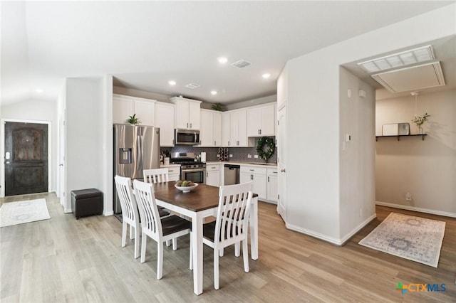 2024 Cowan Dr, New Braunfels, TX 78132 - dining area featuring light wood-type flooring, attic access, and recessed lighting