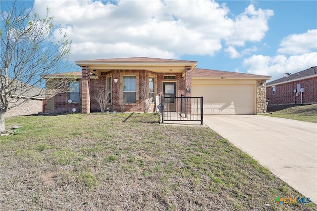 ranch-style house with a front lawn, an attached garage, brick siding, and driveway