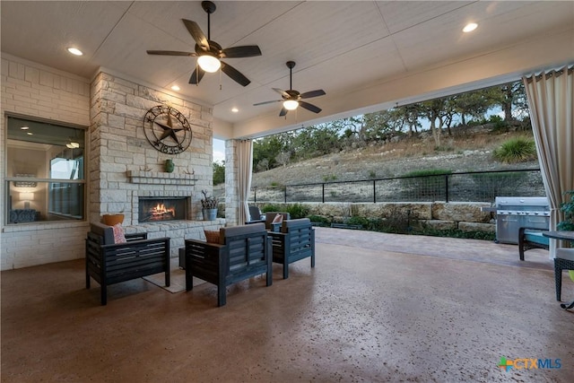 view of patio featuring grilling area and an outdoor stone fireplace