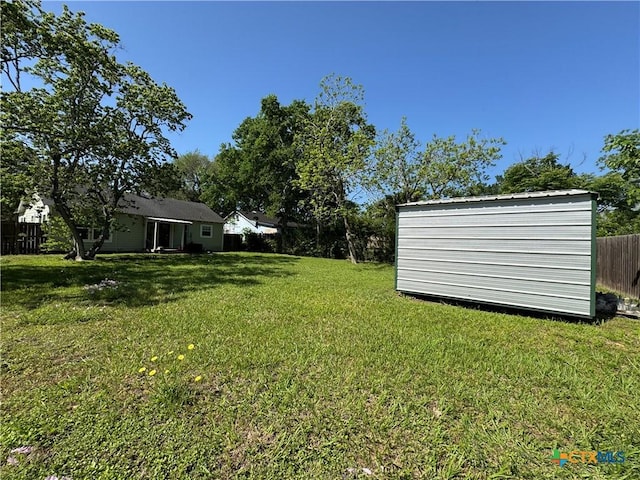 1308 E Park Ave, Victoria, TX 77901 - view of yard featuring an outdoor structure and a storage unit