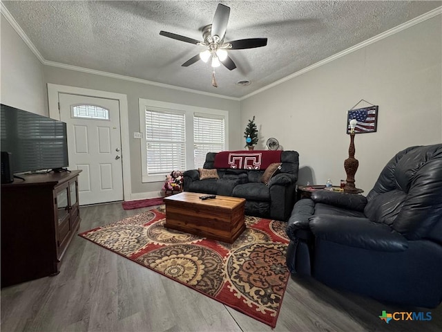1308 E Park Ave, Victoria, TX 77901 - living area with wood finished floors, ceiling fan, a textured ceiling, and crown molding