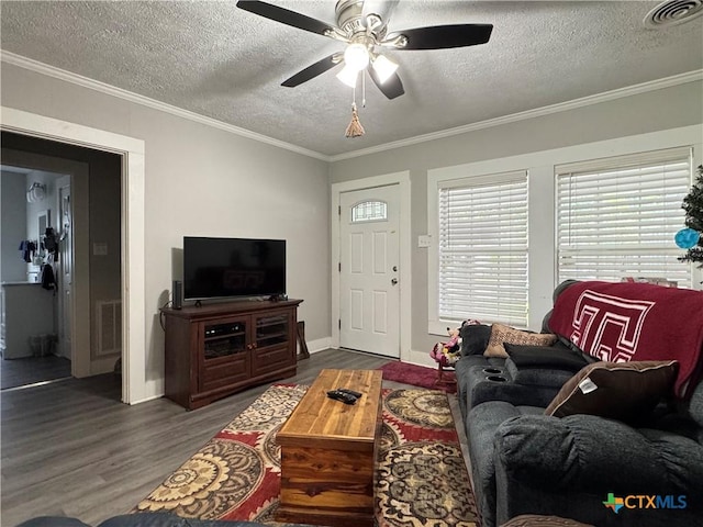 1308 E Park Ave, Victoria, TX 77901 - living area with wood finished floors, a textured ceiling, crown molding, a ceiling fan, and baseboards
