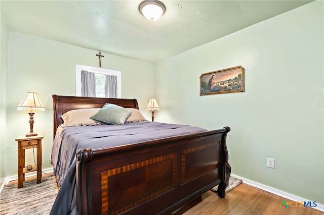 bedroom featuring light hardwood / wood-style floors