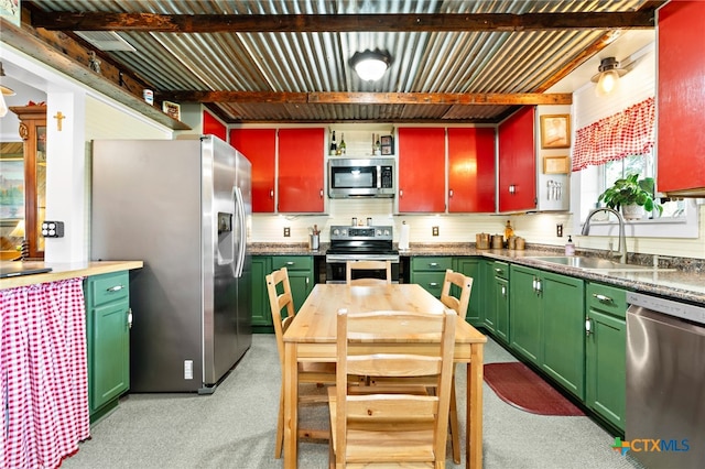 kitchen featuring appliances with stainless steel finishes, beam ceiling, decorative backsplash, sink, and light colored carpet