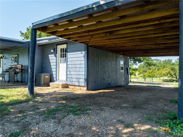 view of outdoor structure featuring central AC