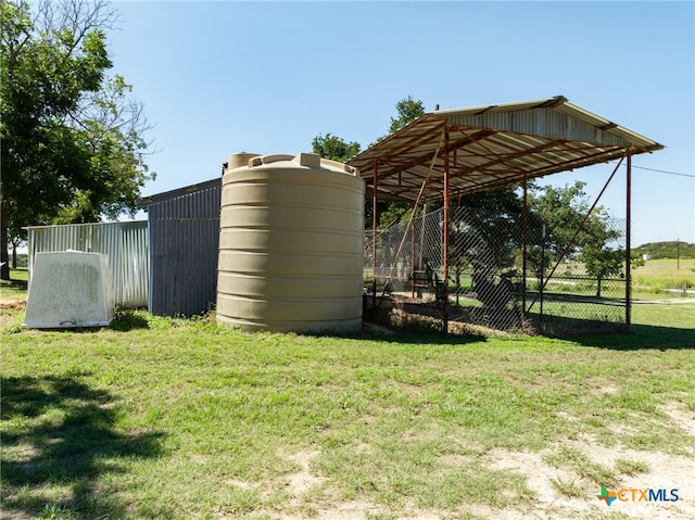 view of outbuilding with a lawn