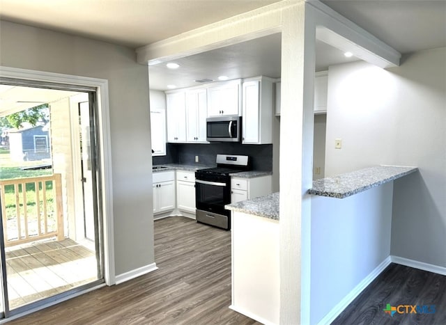 kitchen with stainless steel appliances, tasteful backsplash, dark hardwood / wood-style floors, light stone countertops, and white cabinetry