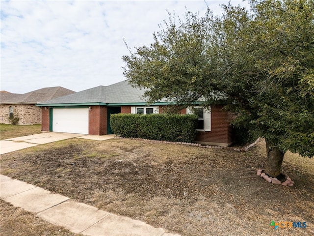 single story home featuring a garage