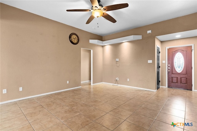 entrance foyer featuring ceiling fan and light tile patterned floors