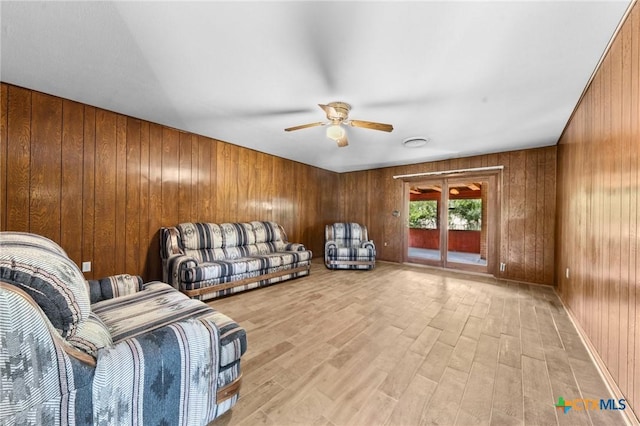 707 Dianne Dr, Copperas Cove, TX 76522 - living room with ceiling fan, wooden walls, and light wood finished floors