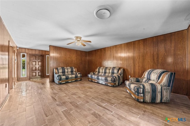 707 Dianne Dr, Copperas Cove, TX 76522 - living area with wooden walls, a ceiling fan, and wood finished floors