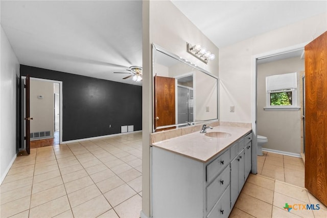 707 Dianne Dr, Copperas Cove, TX 76522 - bathroom featuring toilet, ceiling fan, vanity, tile patterned floors, and baseboards