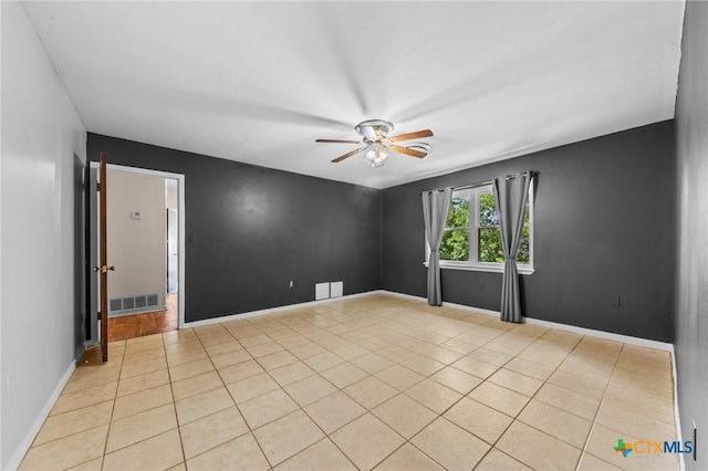 707 Dianne Dr, Copperas Cove, TX 76522 - spare room featuring a ceiling fan, light tile patterned floors, and baseboards