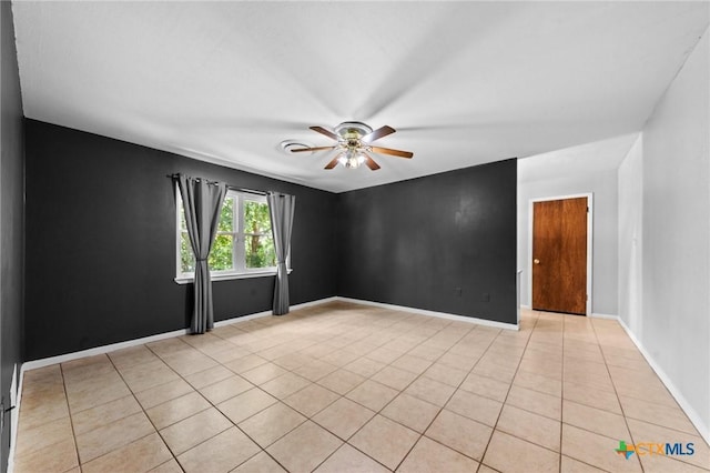 707 Dianne Dr, Copperas Cove, TX 76522 - empty room featuring ceiling fan, light tile patterned floors, and baseboards